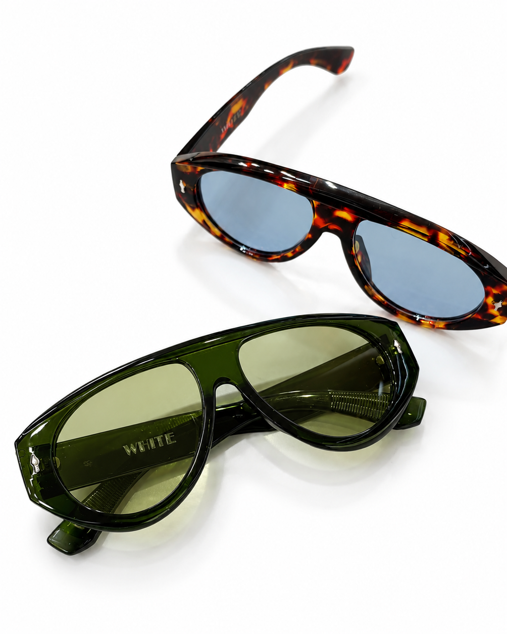 Oversized tortoiseshell sunglasses featuring blue-tinted lenses and a bold glossy frame