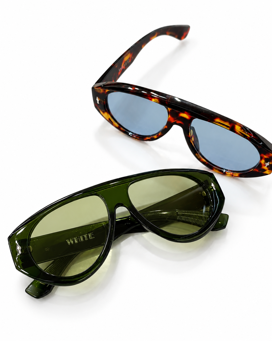 Oversized tortoiseshell sunglasses featuring blue-tinted lenses and a bold glossy frame