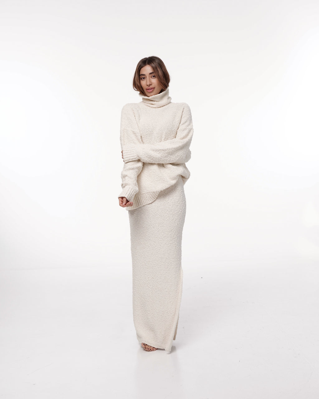 Cream knit maxi skirt paired with a matching cream turtleneck sweater
